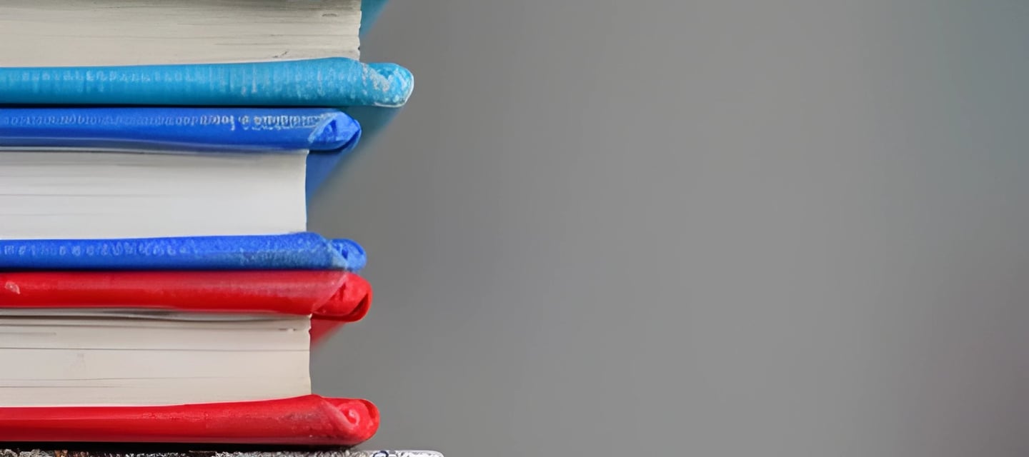 Stack of colorful books representing study abroad scholarship and assistantship guidance