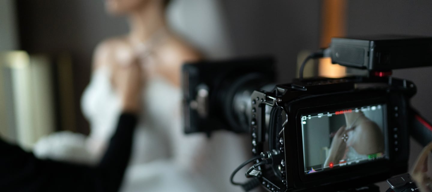 Glasgow wedding videographer filming bridal prep on cinema camera.