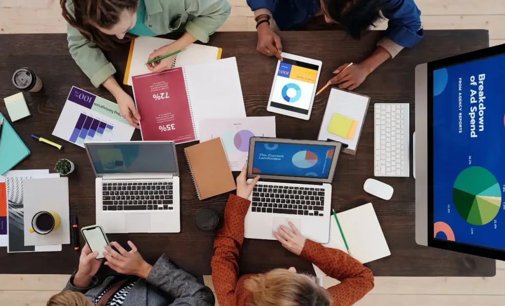 Marketing team at TrendBeatz Technologies analyzing advertising performance reports and digital camp