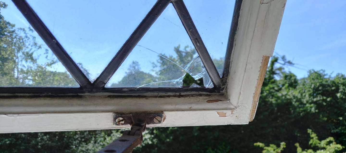 broken pane in leaded-light