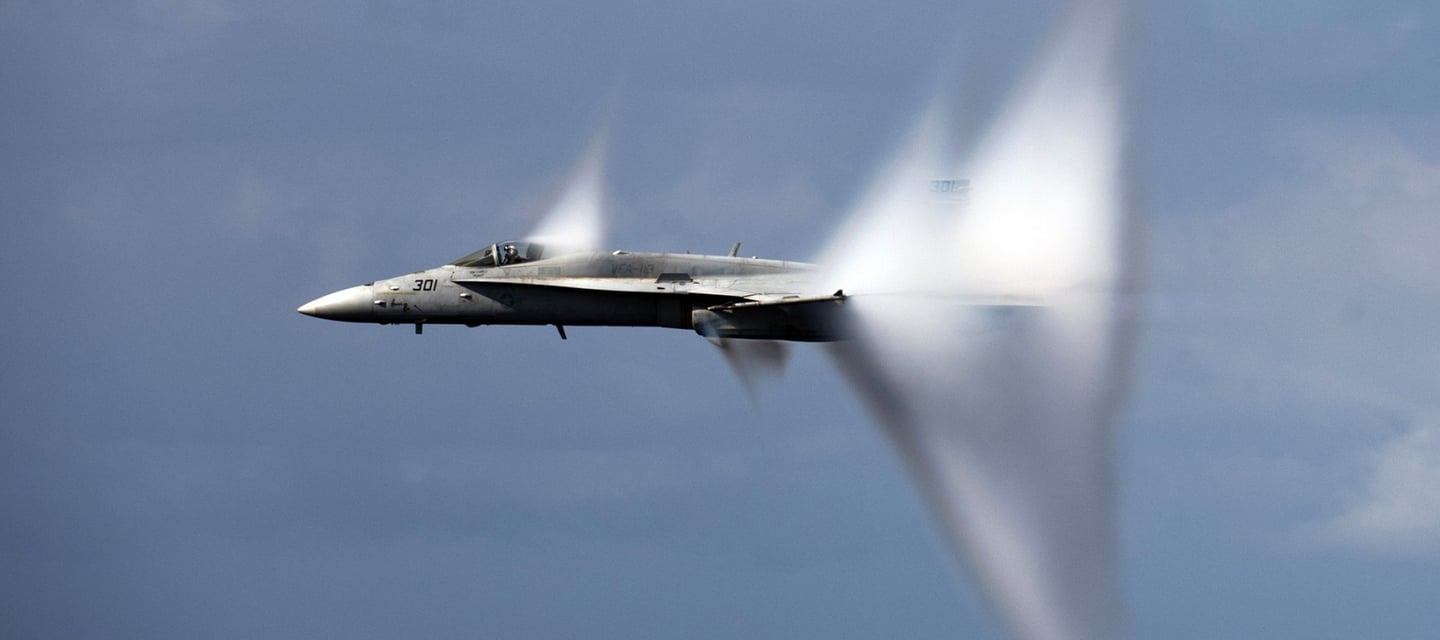 a jet fighter flying through the air