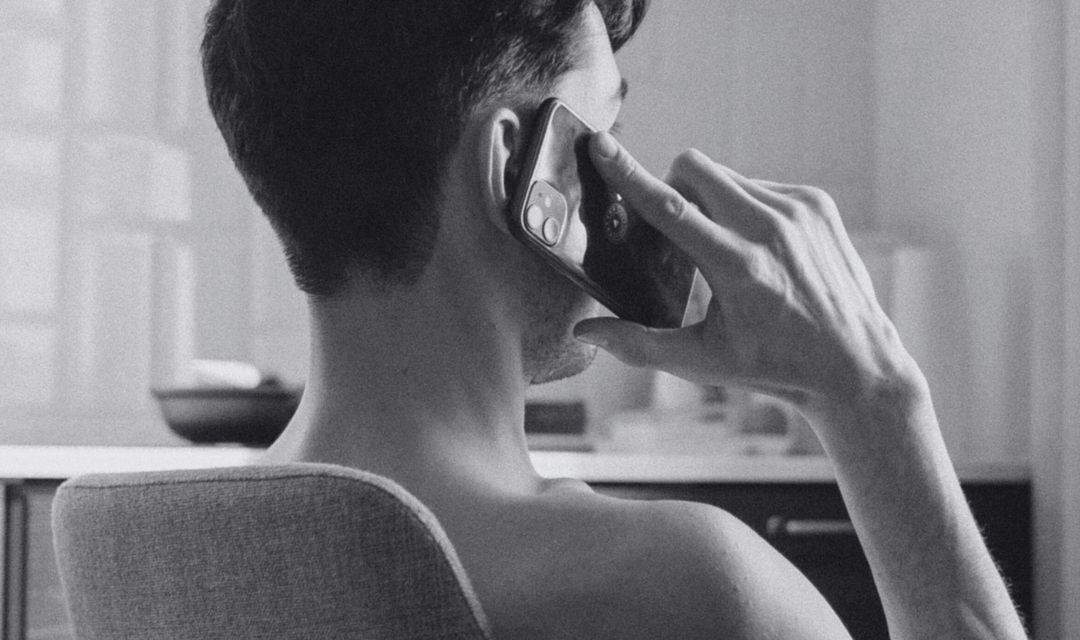A man talking to a women he is dating on the phone rather than texting her.