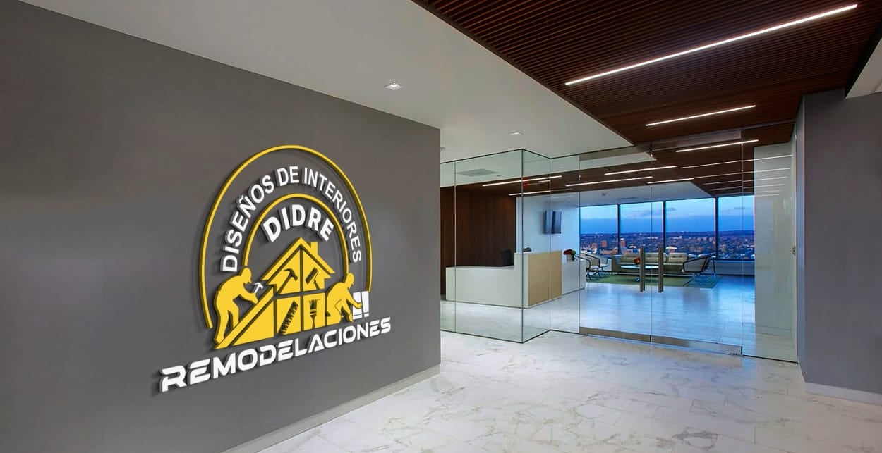 Modern office lobby with the Diseños de Interiores DIDRE Remodelaciones logo on a gray wall.