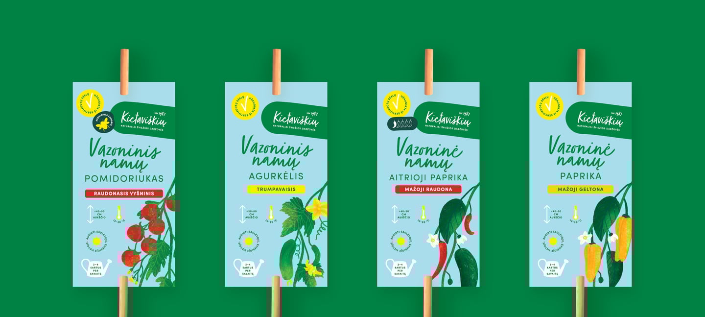 Kietaviškių vazoninių augalų vėliavėlės su stilizuotomis daržovių iliustracijomis – pakuotės identifikavimo detalė.