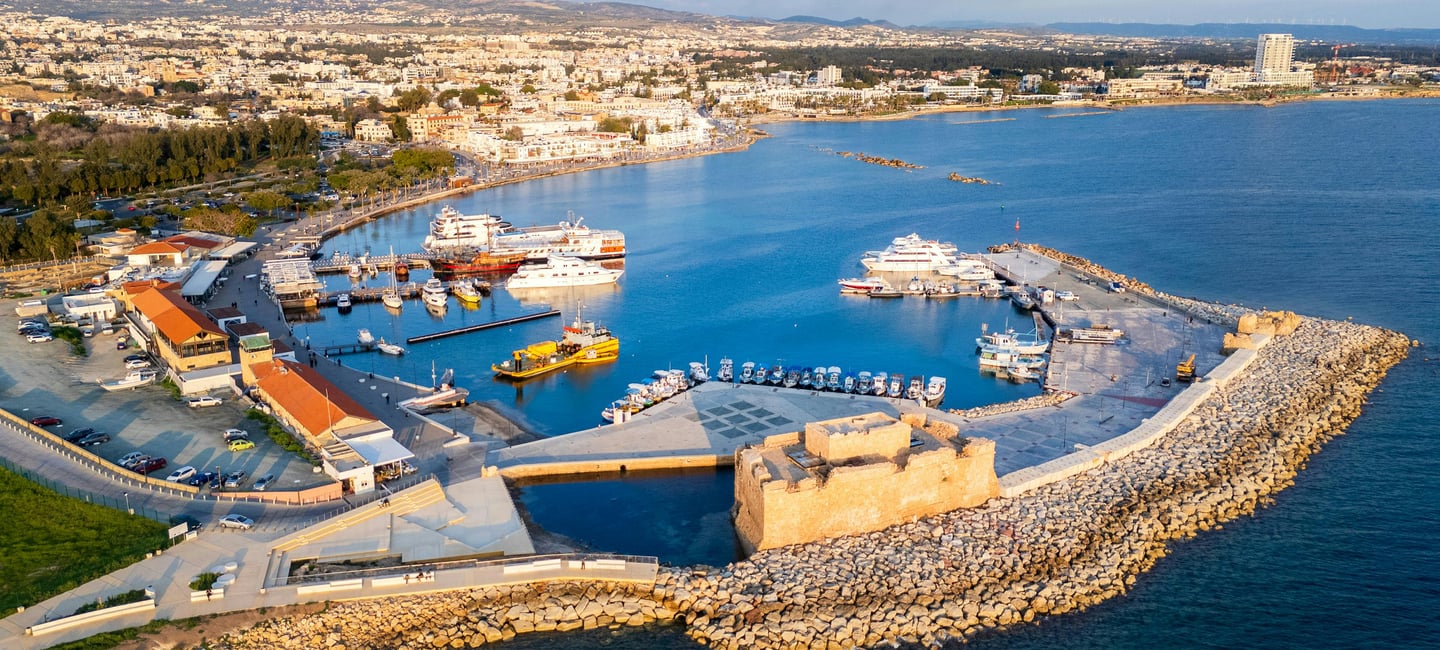Aerial view of Paphos Harbour and the medieval Paphos Castle on the Mediterranean coast of Cyprus.