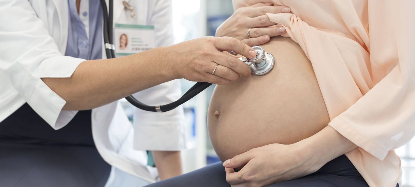 Gynecologist checking patient