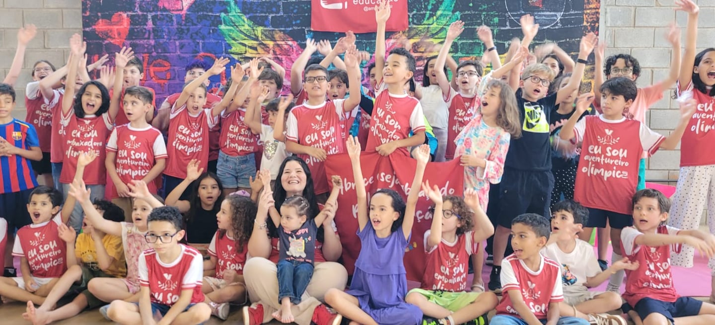 a group of children and adults posing for a photo