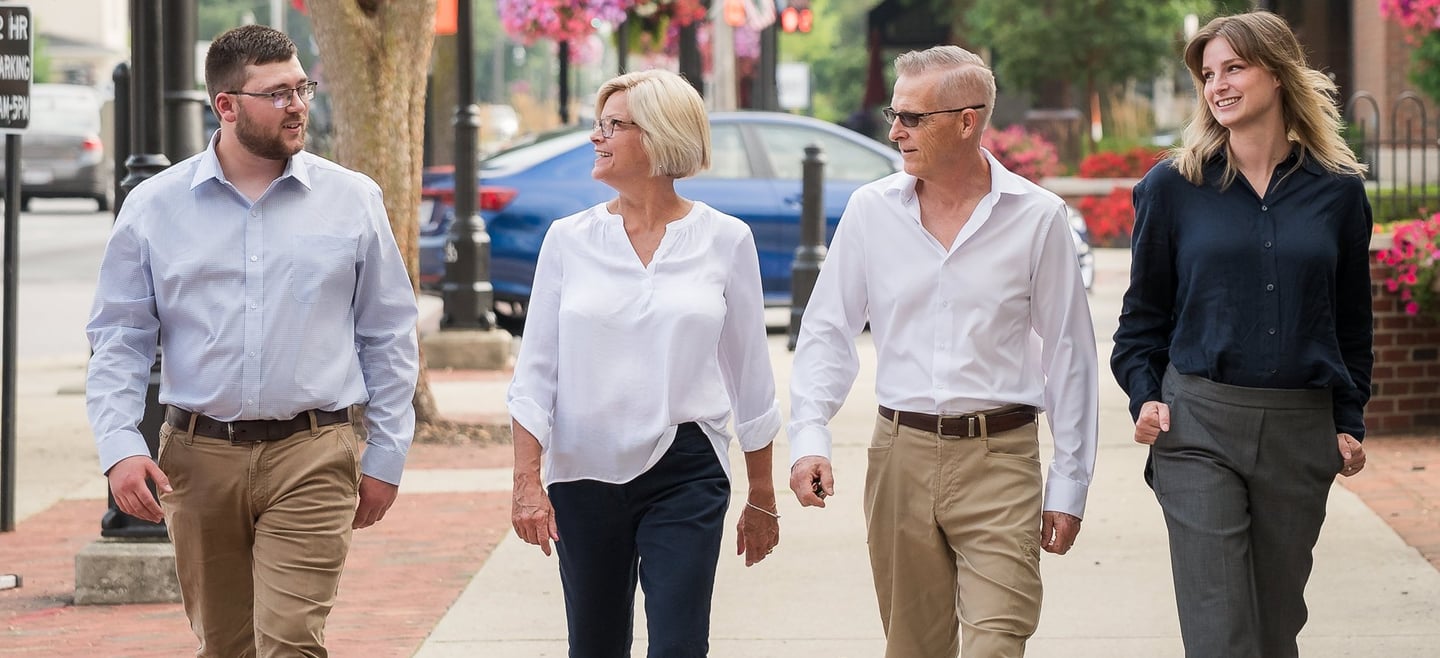 the ogle team walking down broadway in grove city ohio