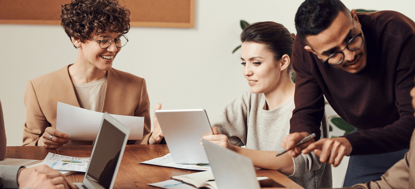 a group of people sitting around a table