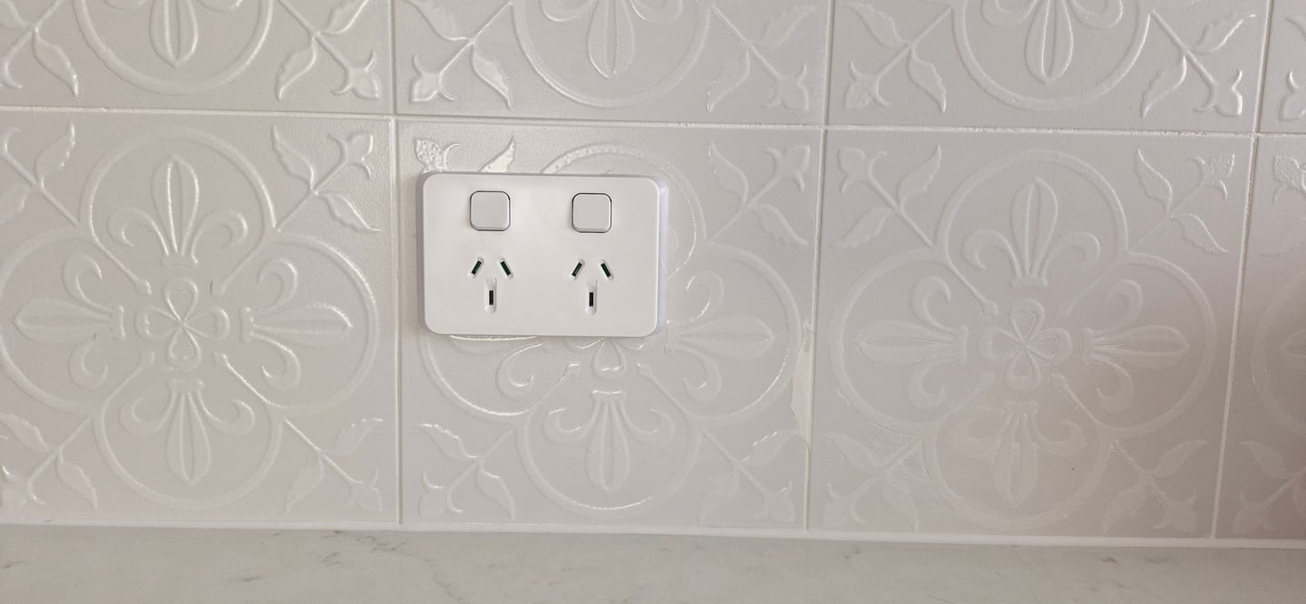 a white power point on a white splash back