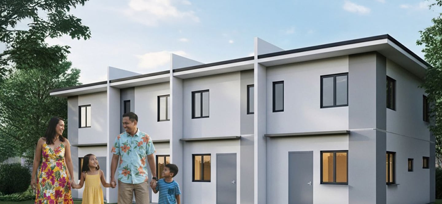 a family standing in front of a house