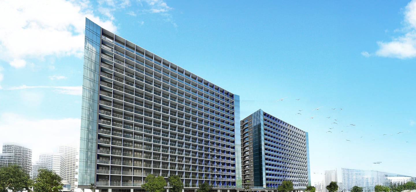 a large building with a lot of windows and a lot of cars