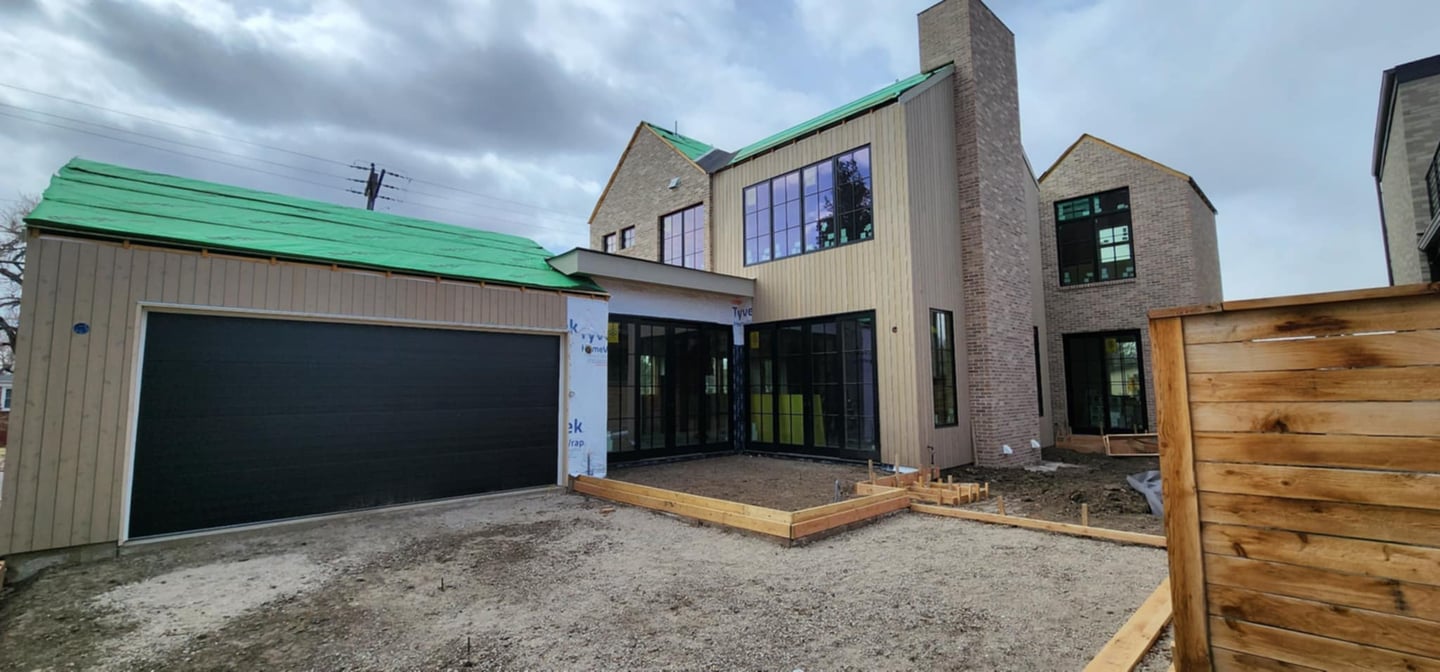 a house with a green roof and a green roof