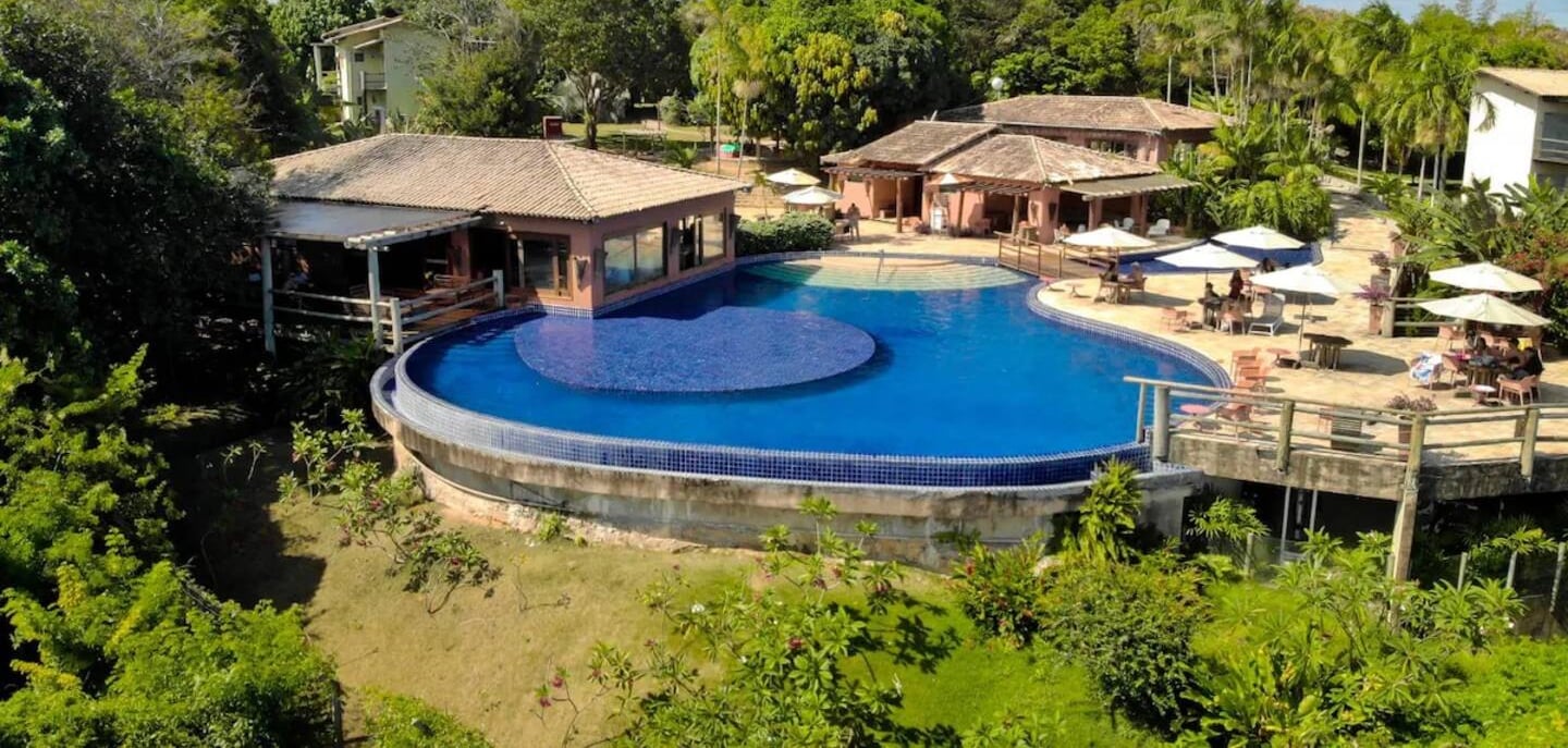 a large pool with a deck and a deck with chairs