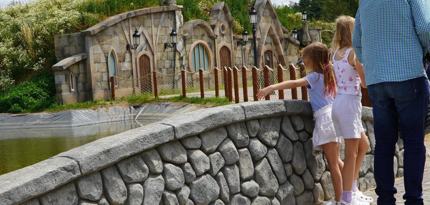 Fish Market themed zone with custom scenic bridges and stonework by Artisan Aleks Company