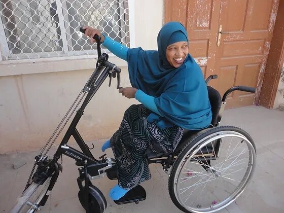 Somali woman in wheelchair, representing inclusivity and empowerment for disabled individuals in Somalia and beyond.
