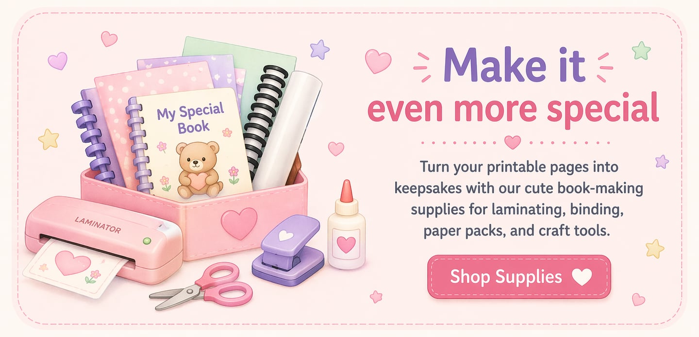 Cute book-making supplies featuring a pink laminator, spiral notebooks, and craft tools for DIY scrapbooking.