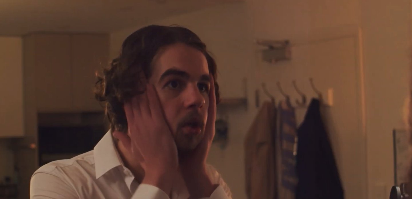 a man with a beard and a white shirt