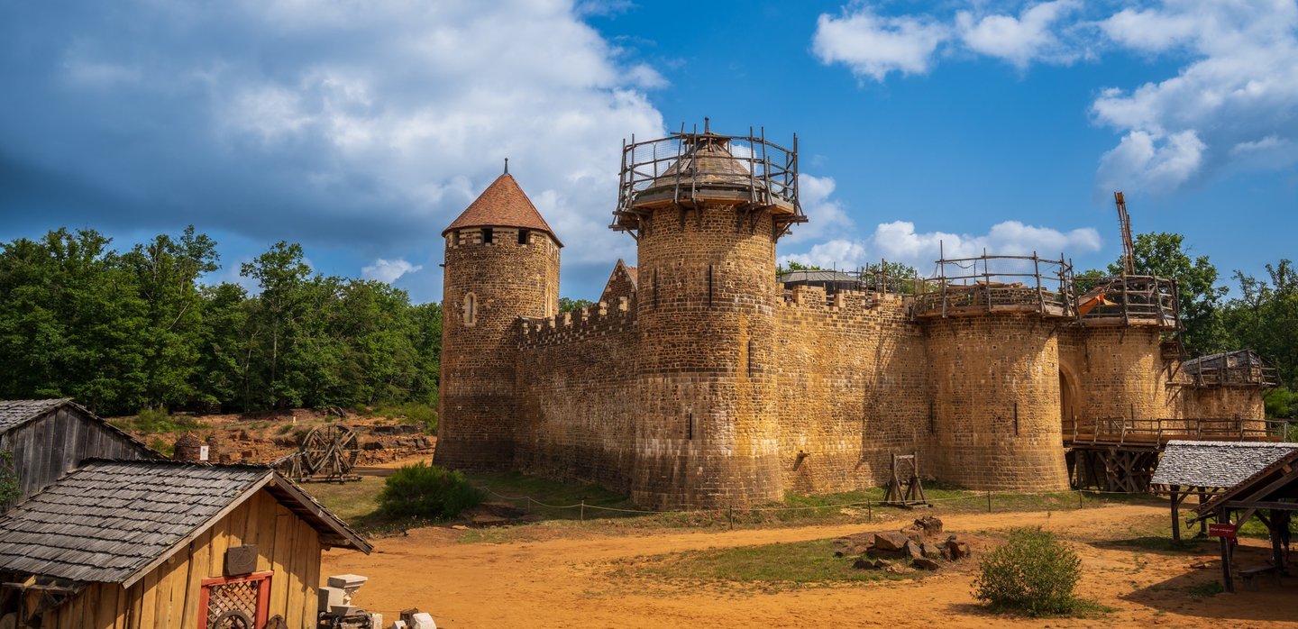 a castle like structure with a tower in the middle of the picture