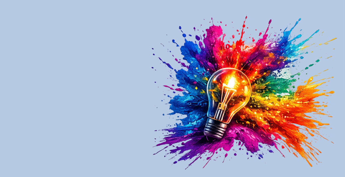 A glowing light bulb surrounded by vibrant colorful paint splashes, symbolizing creative ideas and innovation.