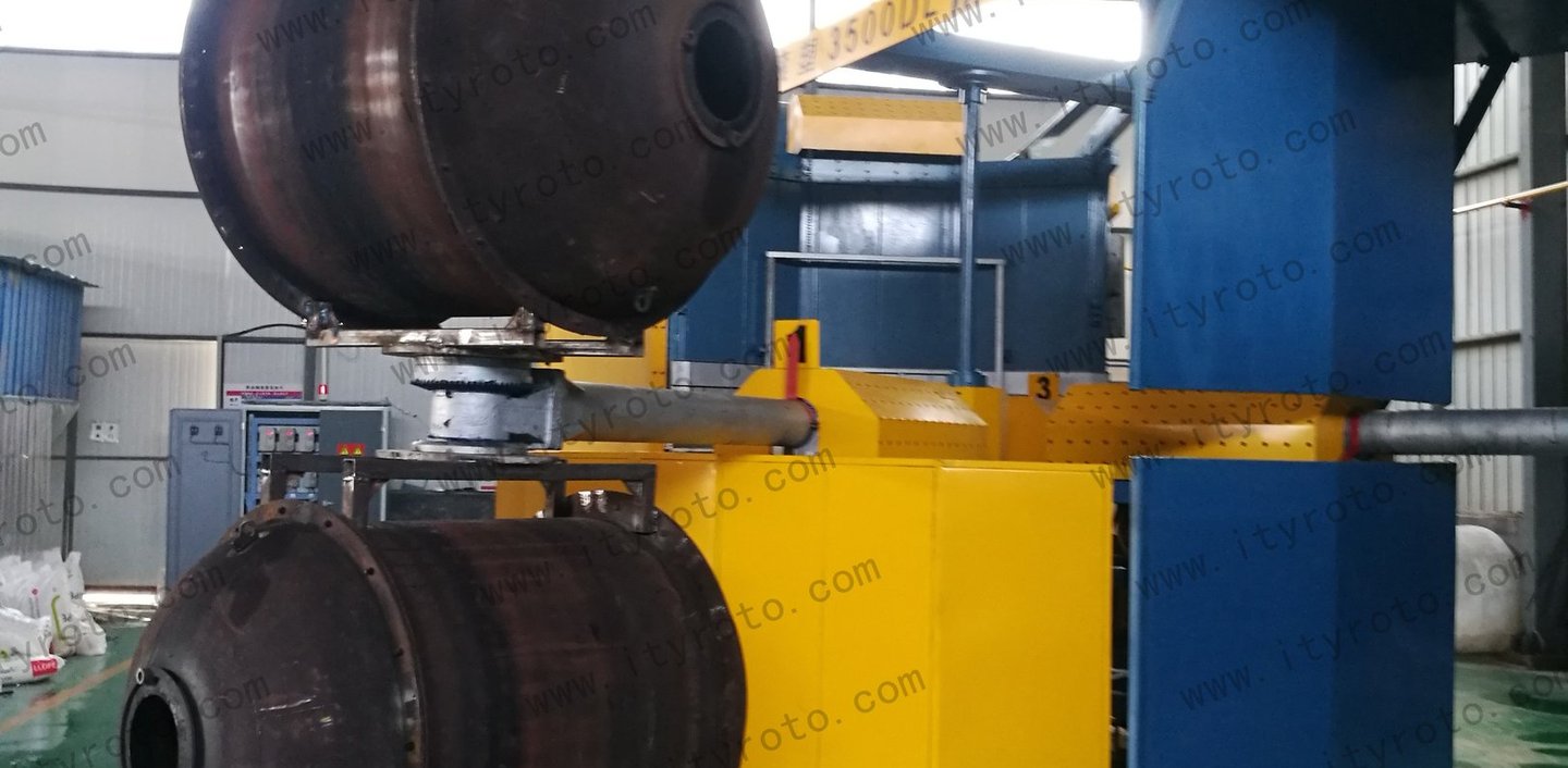 Rotomolding machine used for plastic water tank and container production.