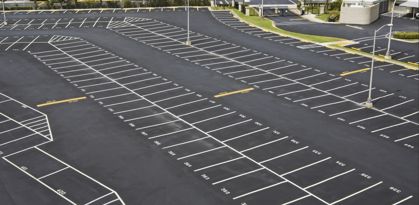 an empty newly striped parking lot