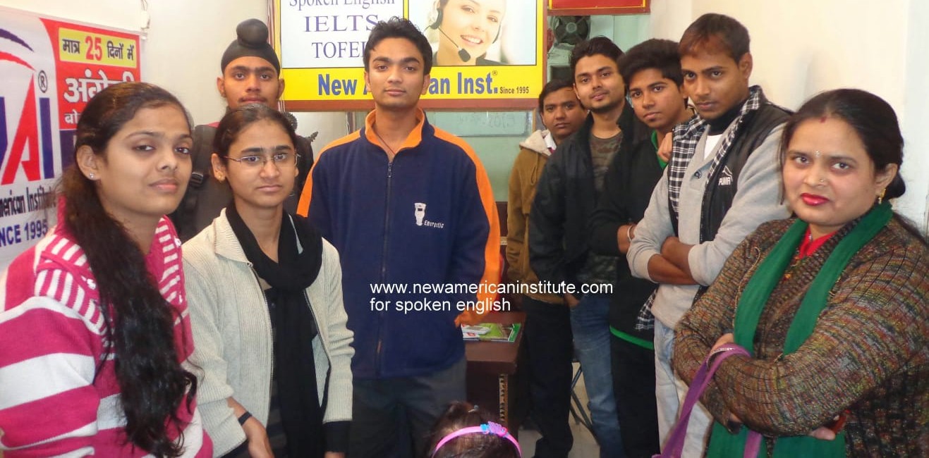 a group of people standing in front of a poster
