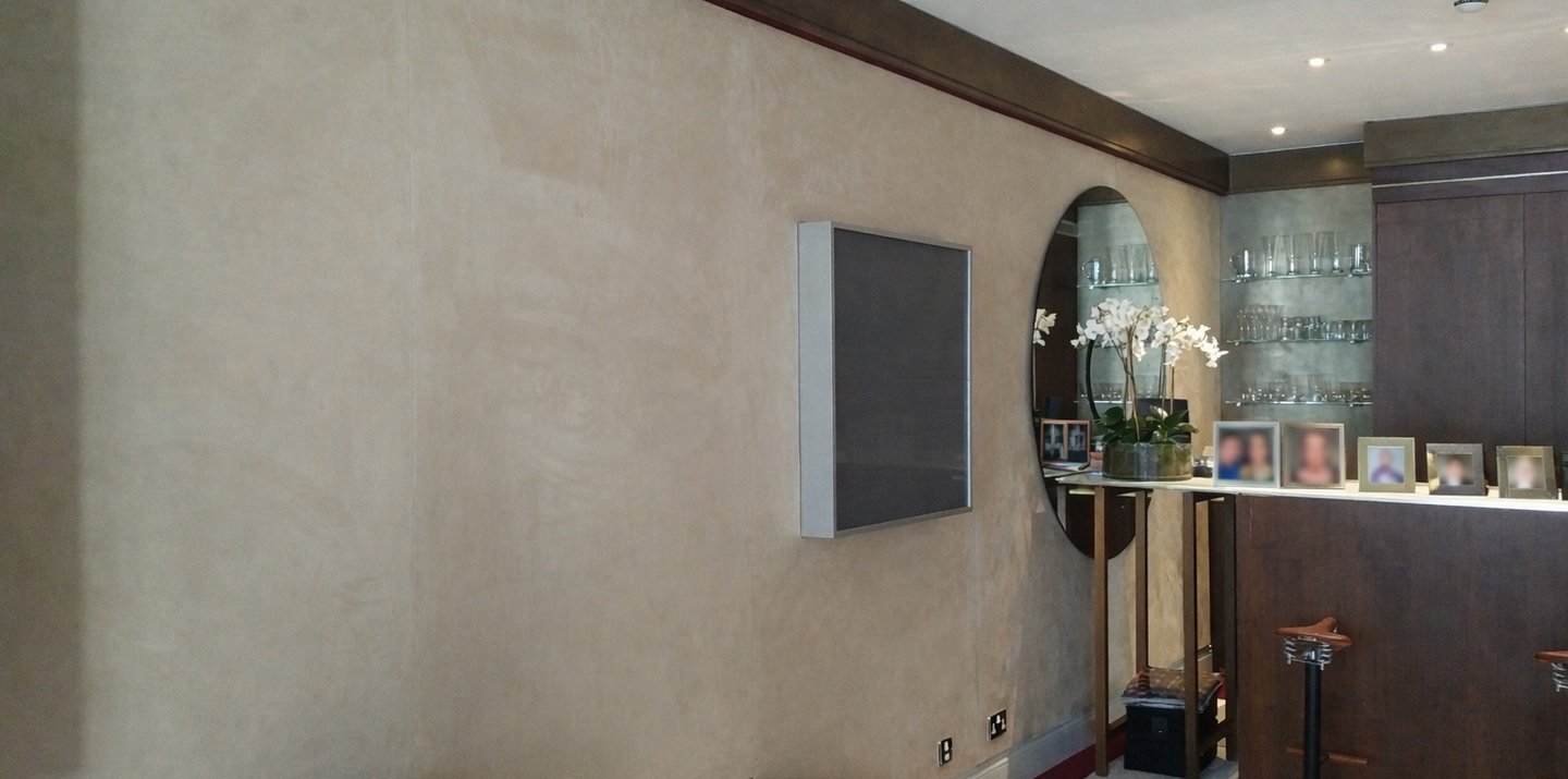 Neutral fabric wall finish in a residential living room