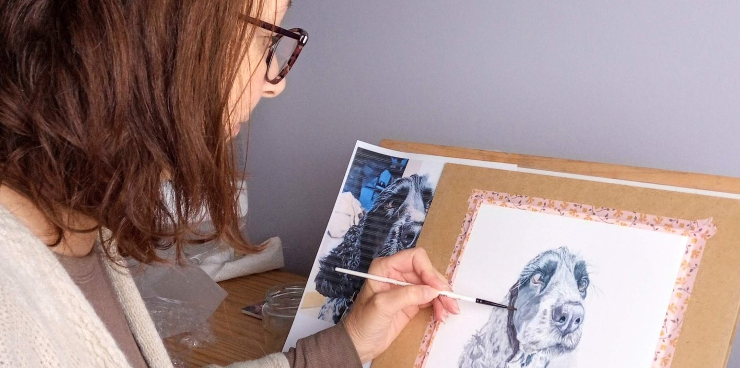 Artist painting a Pet Portrait in her studio