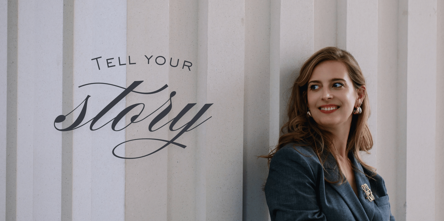 a woman standing in front of a wall with a sign that says tell you '