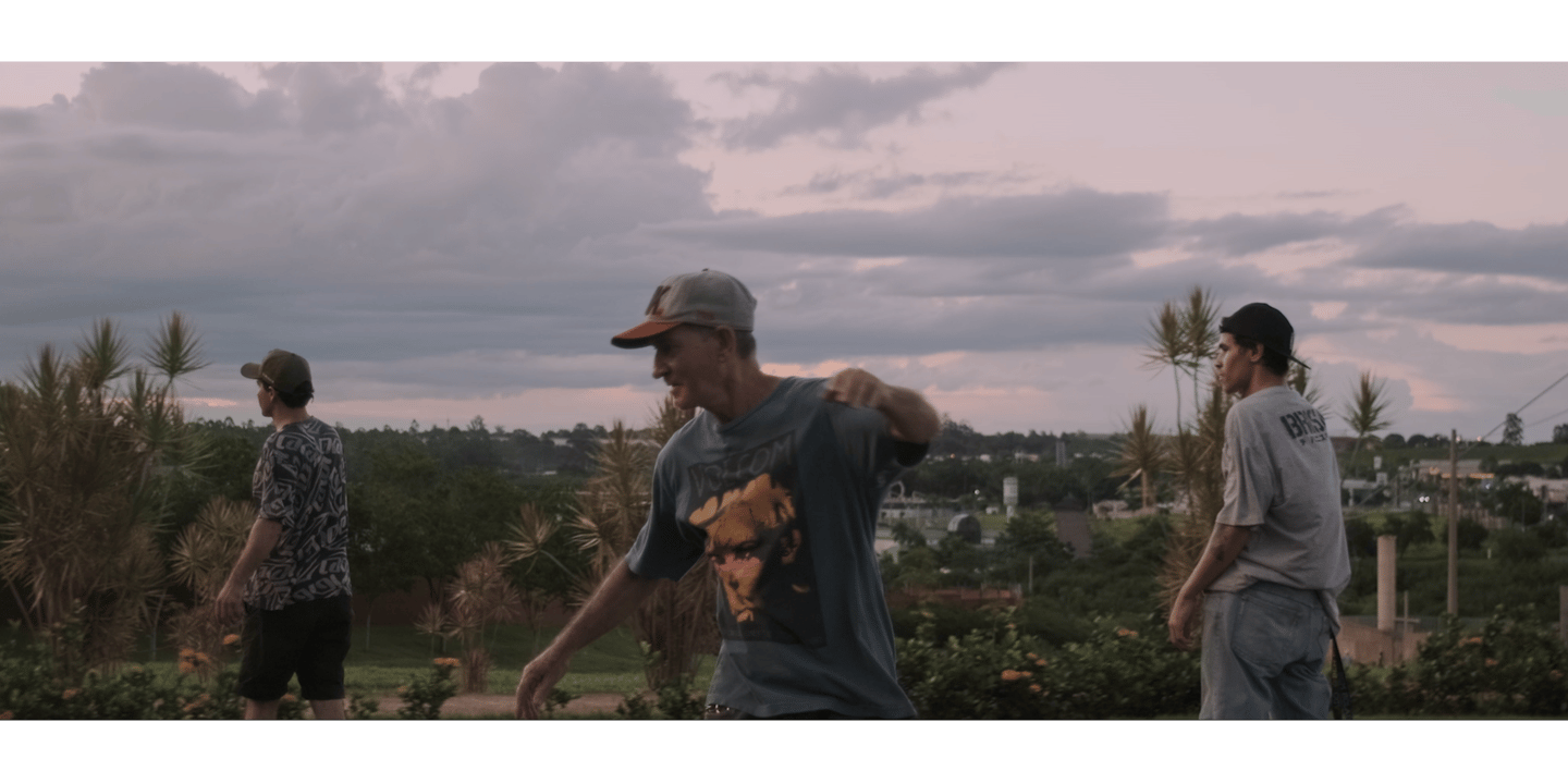 a young child with a cell phone in front of a black background