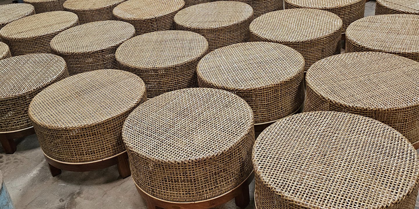 A round rattan table that is both rustic and elegant.