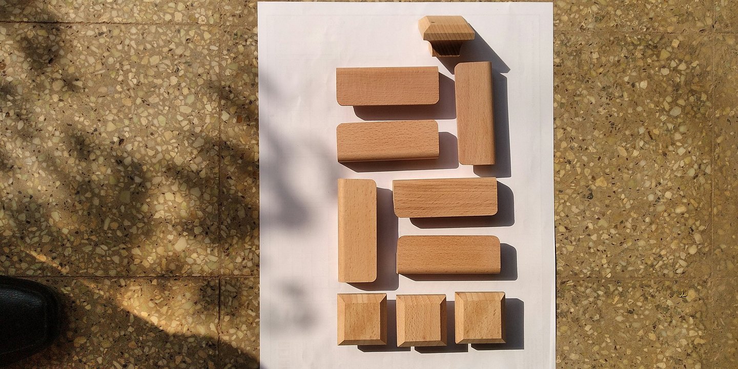 Top-down photo of an arrangement of wooden blocks. Credit Santosh PK via Unsplash.