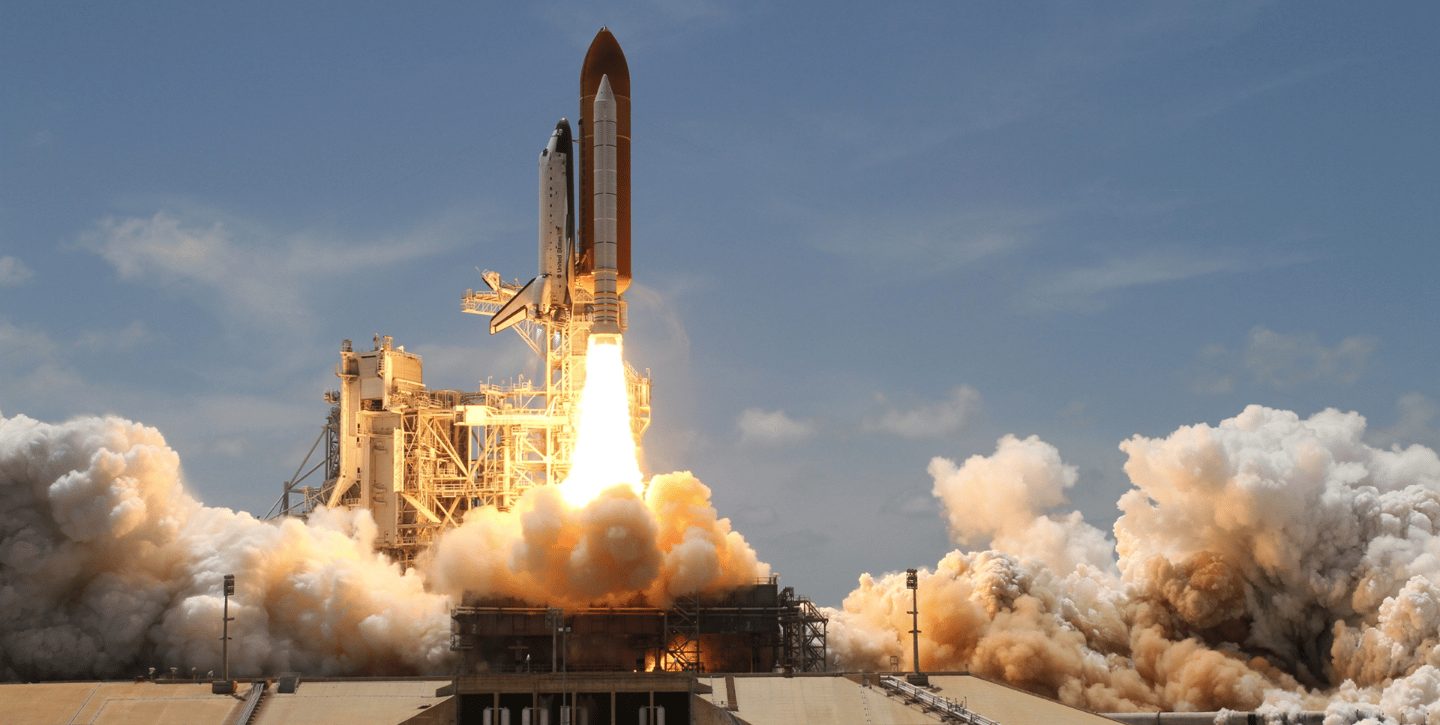a space shuttle carrying a rocket carrying a rocket