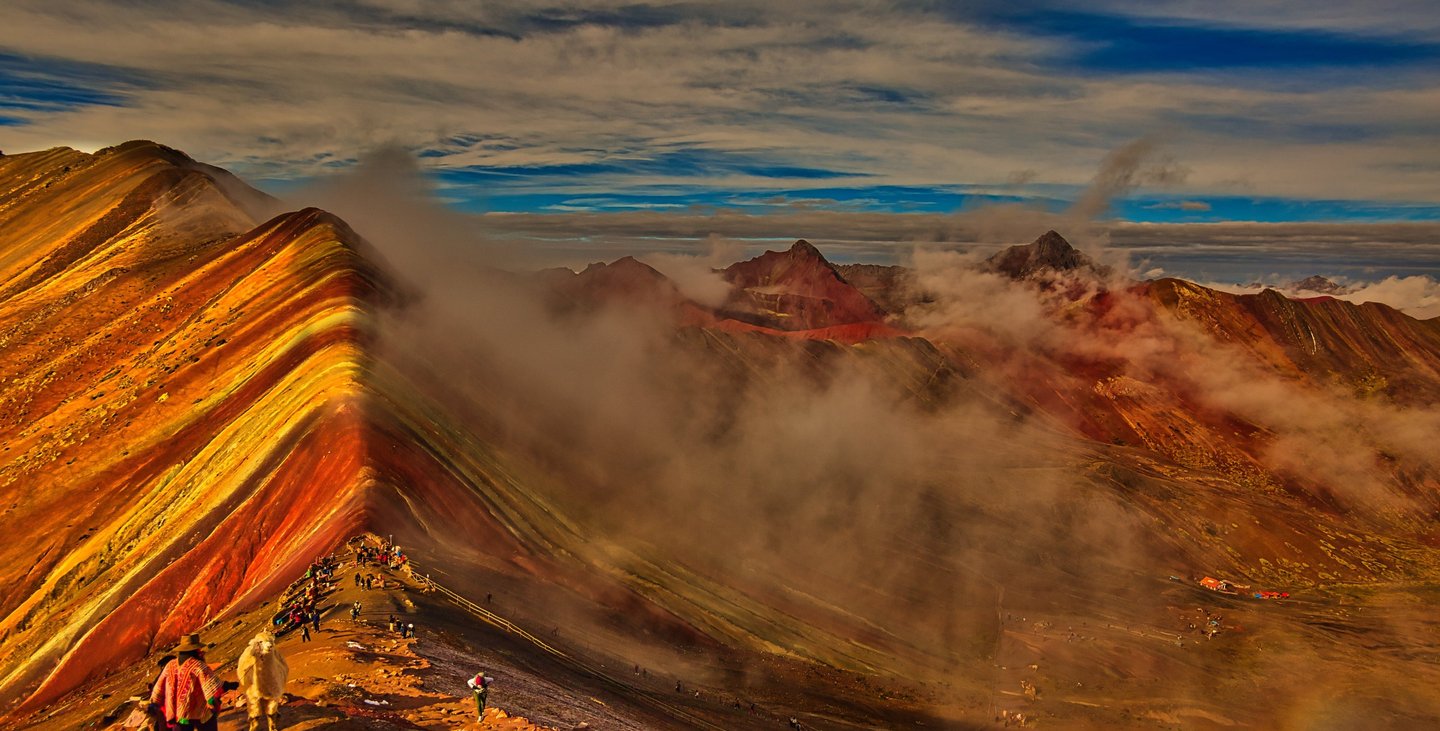 This image shows Vinicunca, the Rainbow Mountain or Mountain of Seven Colors, in Peru’s Andes famed for vibrant stripes.