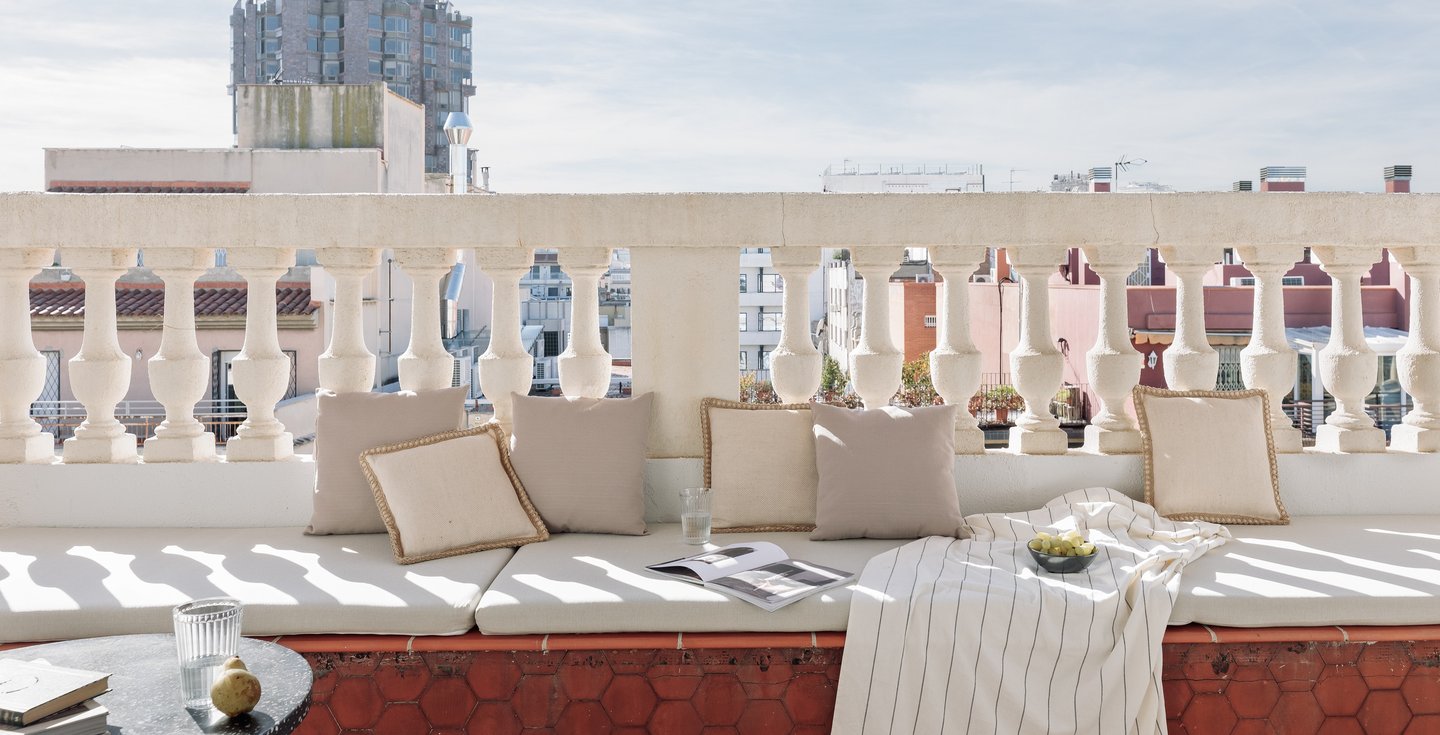 Sunny private terrace with elegant decor and views in Barcelona apartment