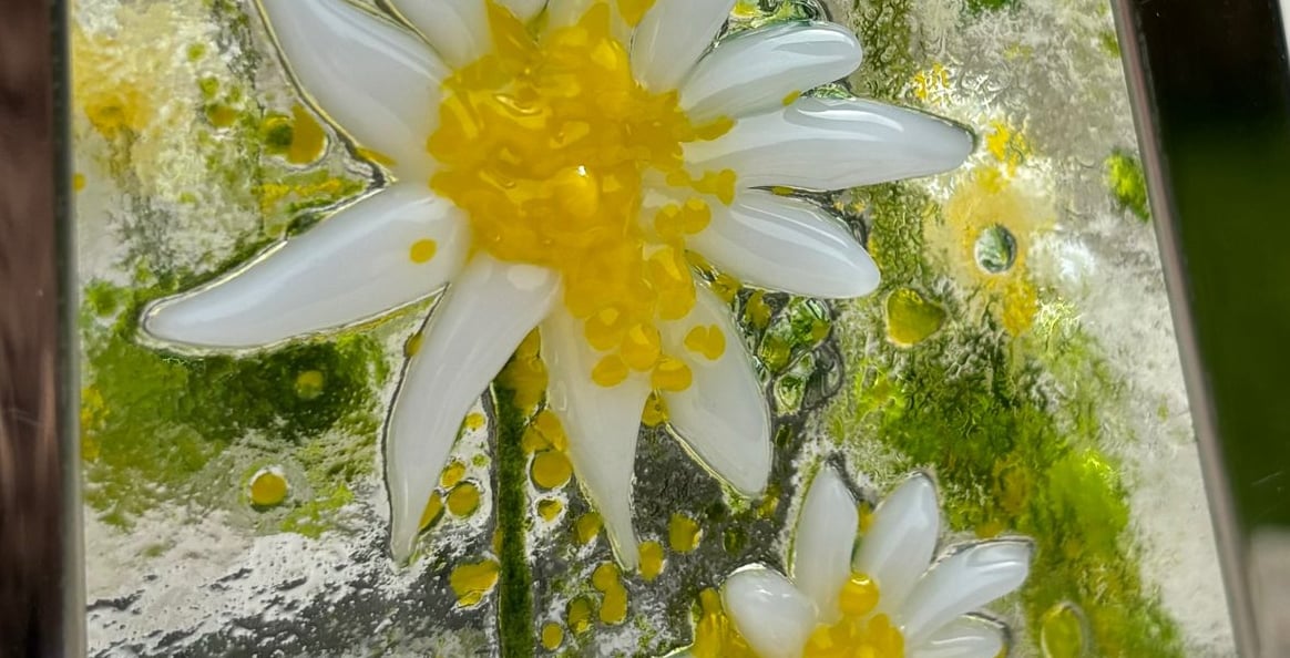 a picture made from fuse glass with flowers