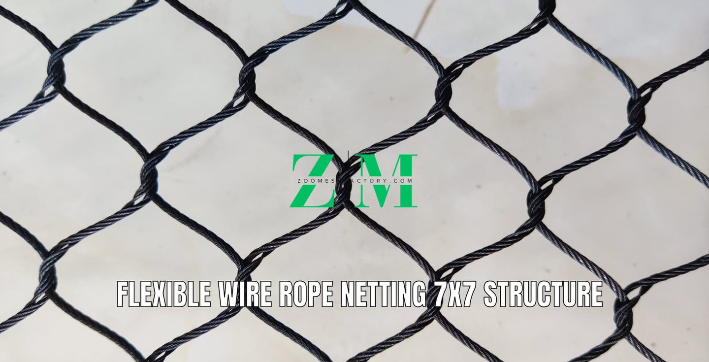 Black flexible stainless steel wire rope netting with a 7x7 diamond mesh structure for safety.