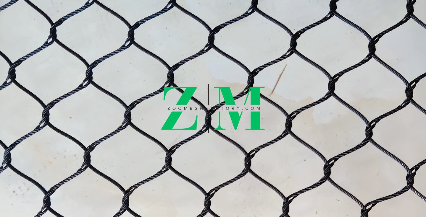 Durable black oxide stainless steel wire rope mesh for safety netting and zoo enclosures.