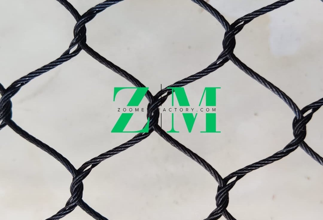 Durable black knotted safety netting featuring a diamond mesh pattern for industrial and garden use.