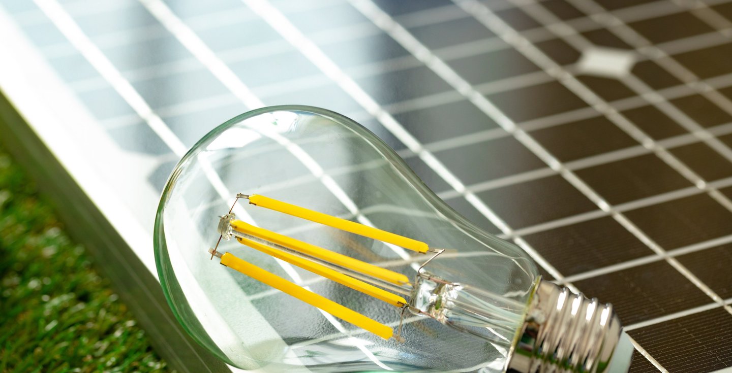 a light bulb bulb on a solar paneled solar powered light bulb