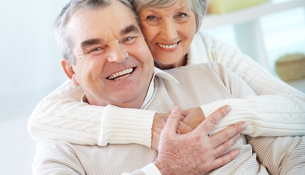 elderly couple smiling