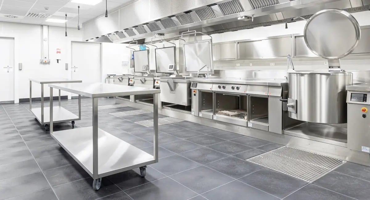 Mobile stainless steel bench Perth in a modern commercial kitchen.