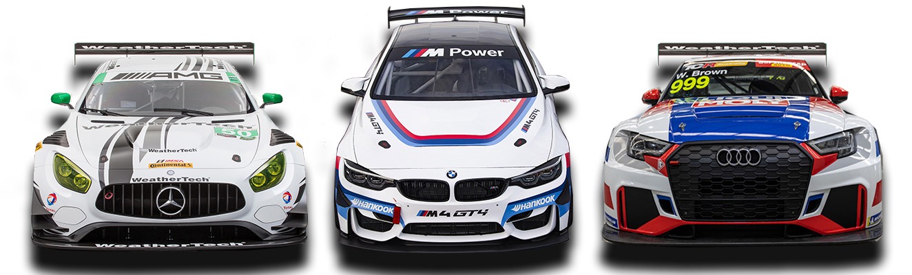 a group of three racing cars with the custom decals and branding ready to race
