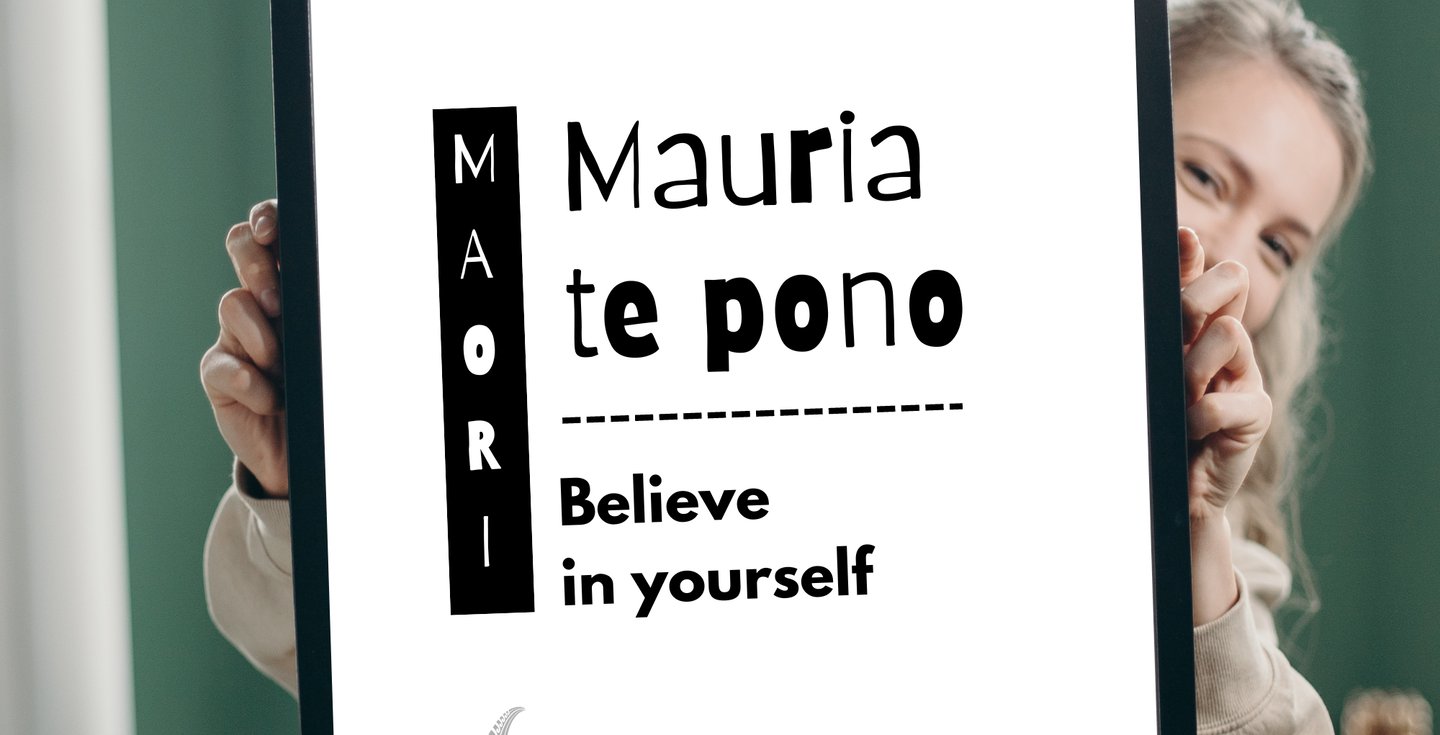 Minimalist Maori proverb wall art poster held by a woman, featuring cultural quote typography design