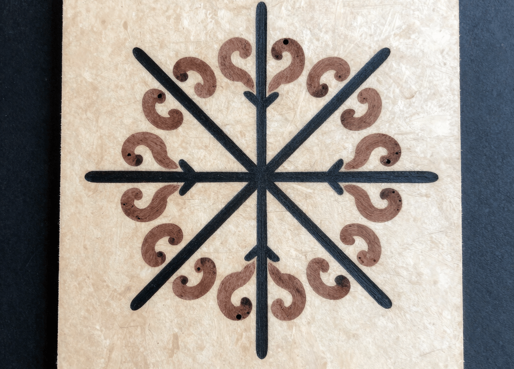 A person holding a paper plate with a circular design on it