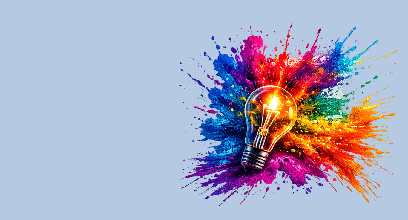 A glowing light bulb surrounded by vibrant colorful paint splashes, symbolizing creative ideas and innovation.