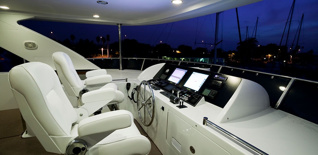 a boats cockpit with large headunit display on dash