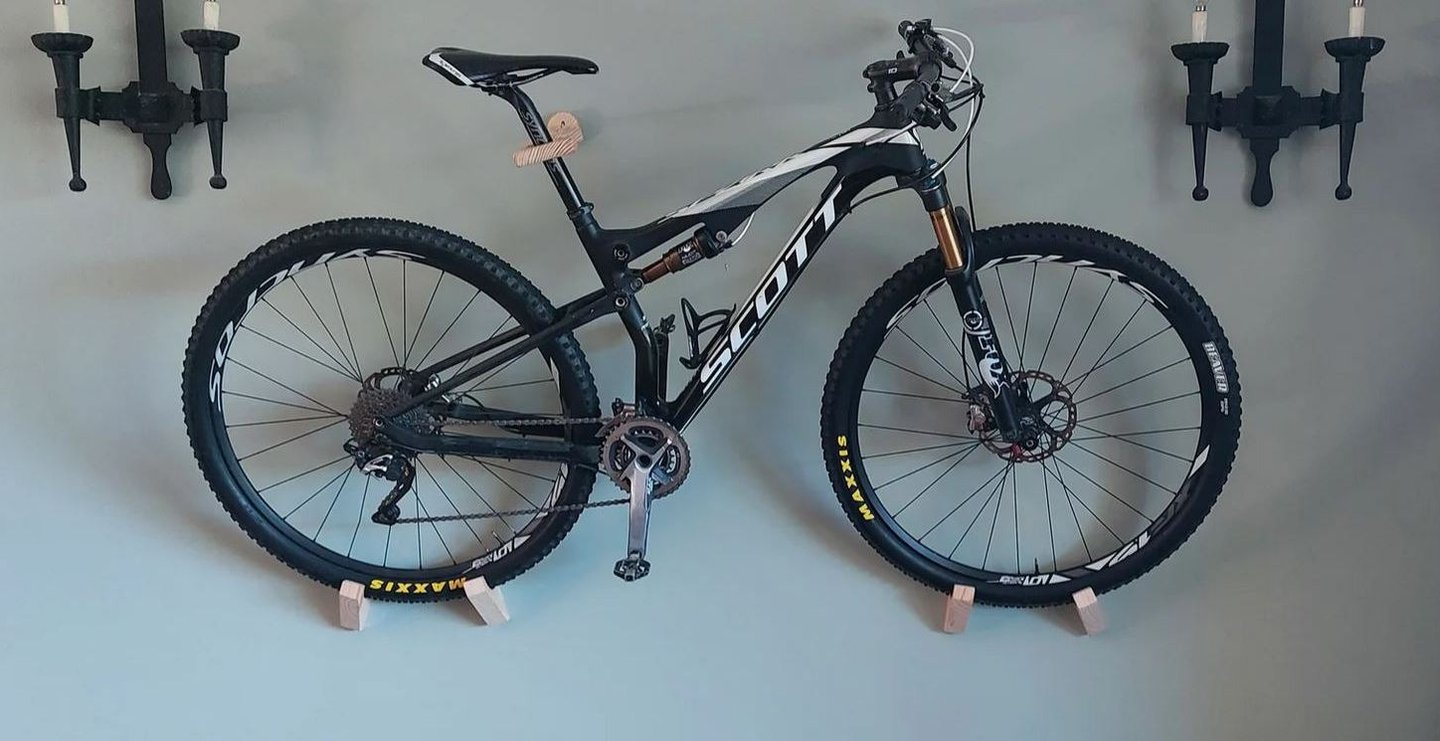 A bicycle mounted on the wall so that it is aesthetically pleasing and can be easily accessed