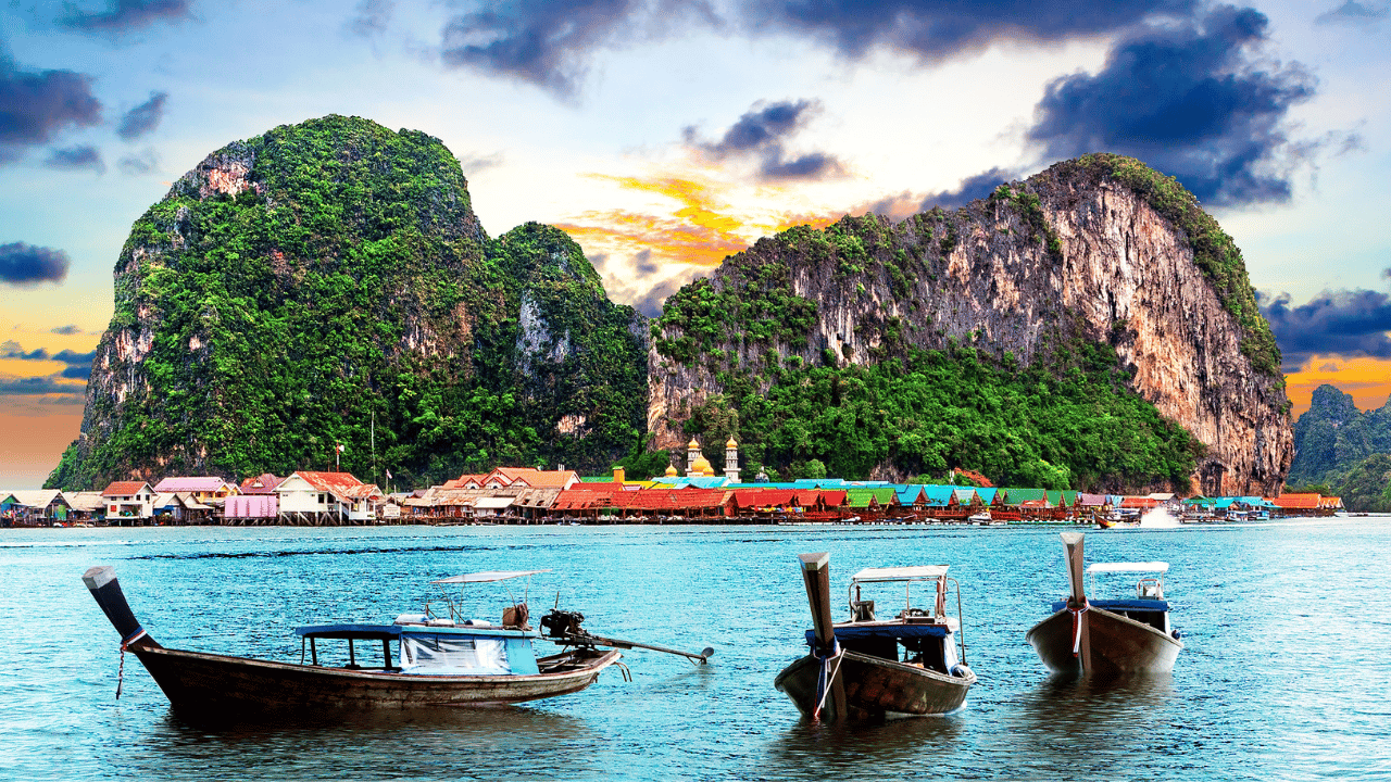 Long boats in a blue sea in Phuket, Thailand.